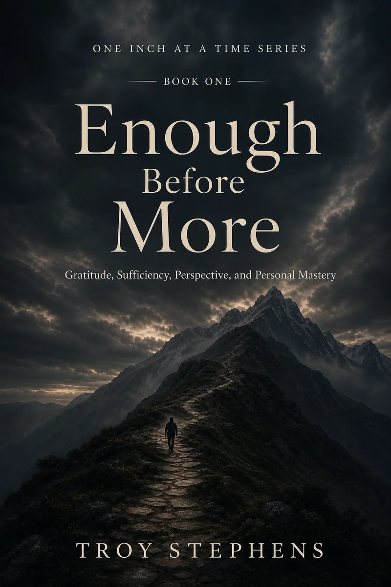 Cover of Enough Before More: a lone figure climbs a stone path up a dark mountain ridge beneath storm clouds.
